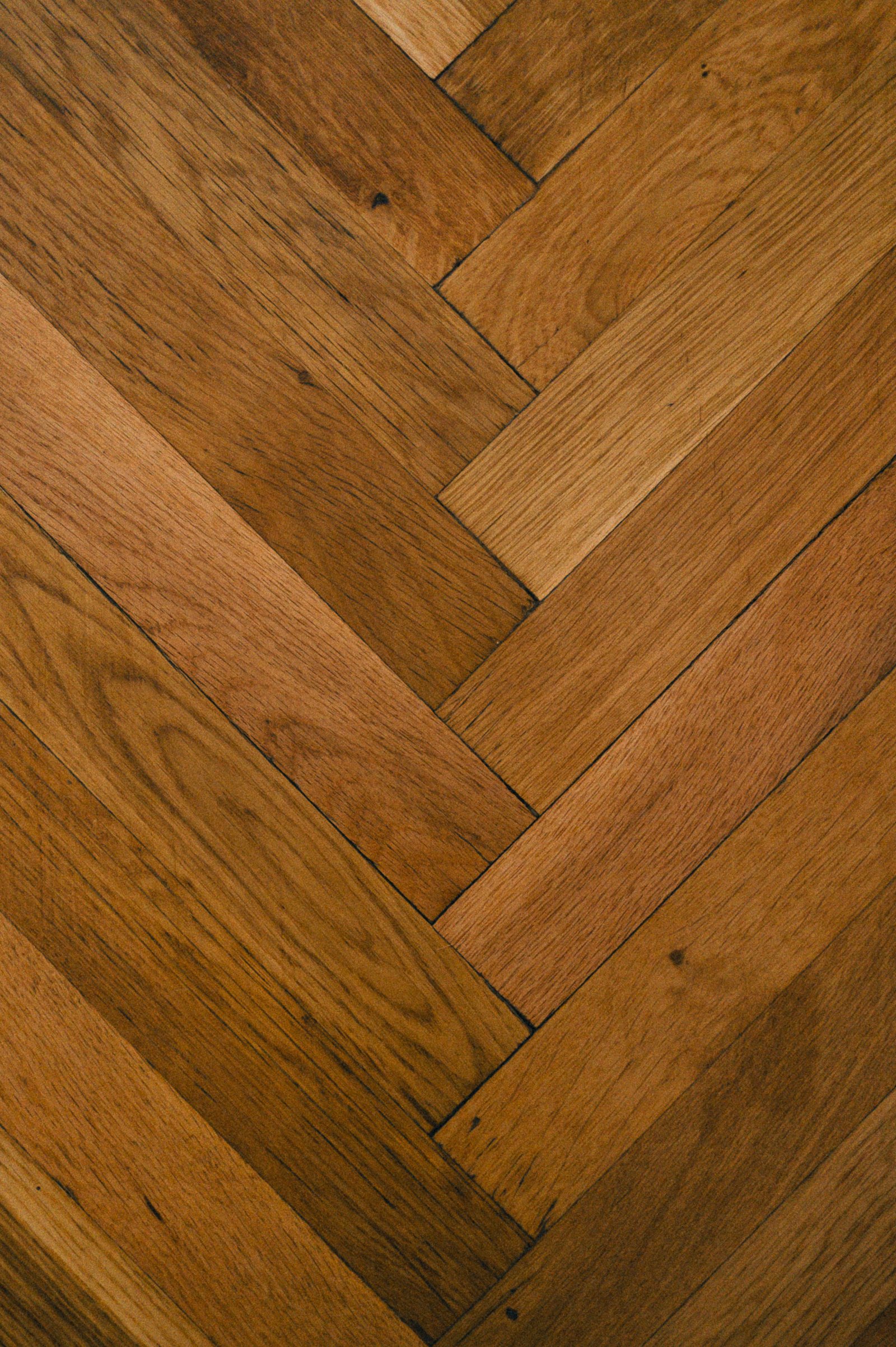 Close-up of herringbone-pattern hardwood flooring
