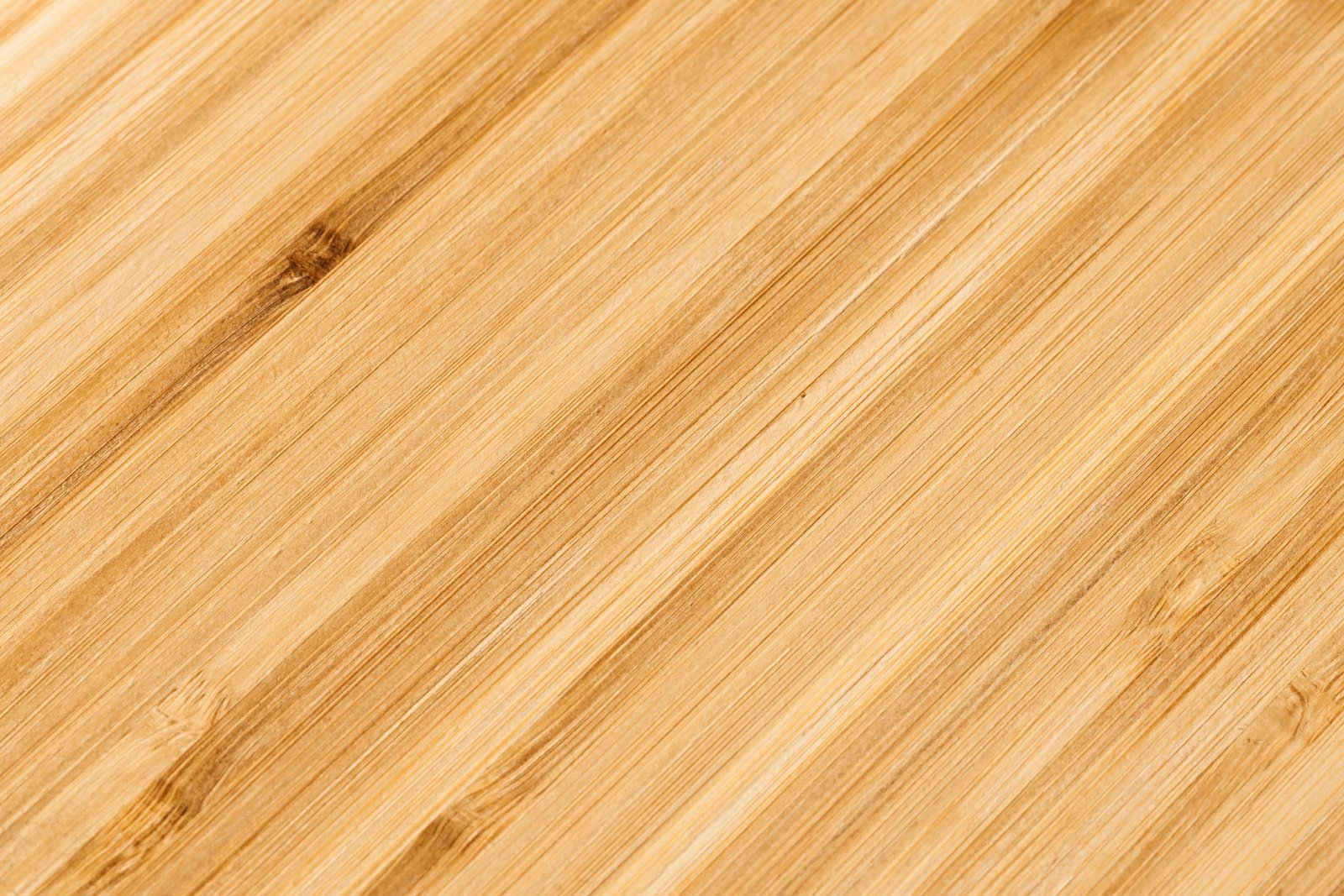 Golden engineered hardwood flooring sample with fine straight grain